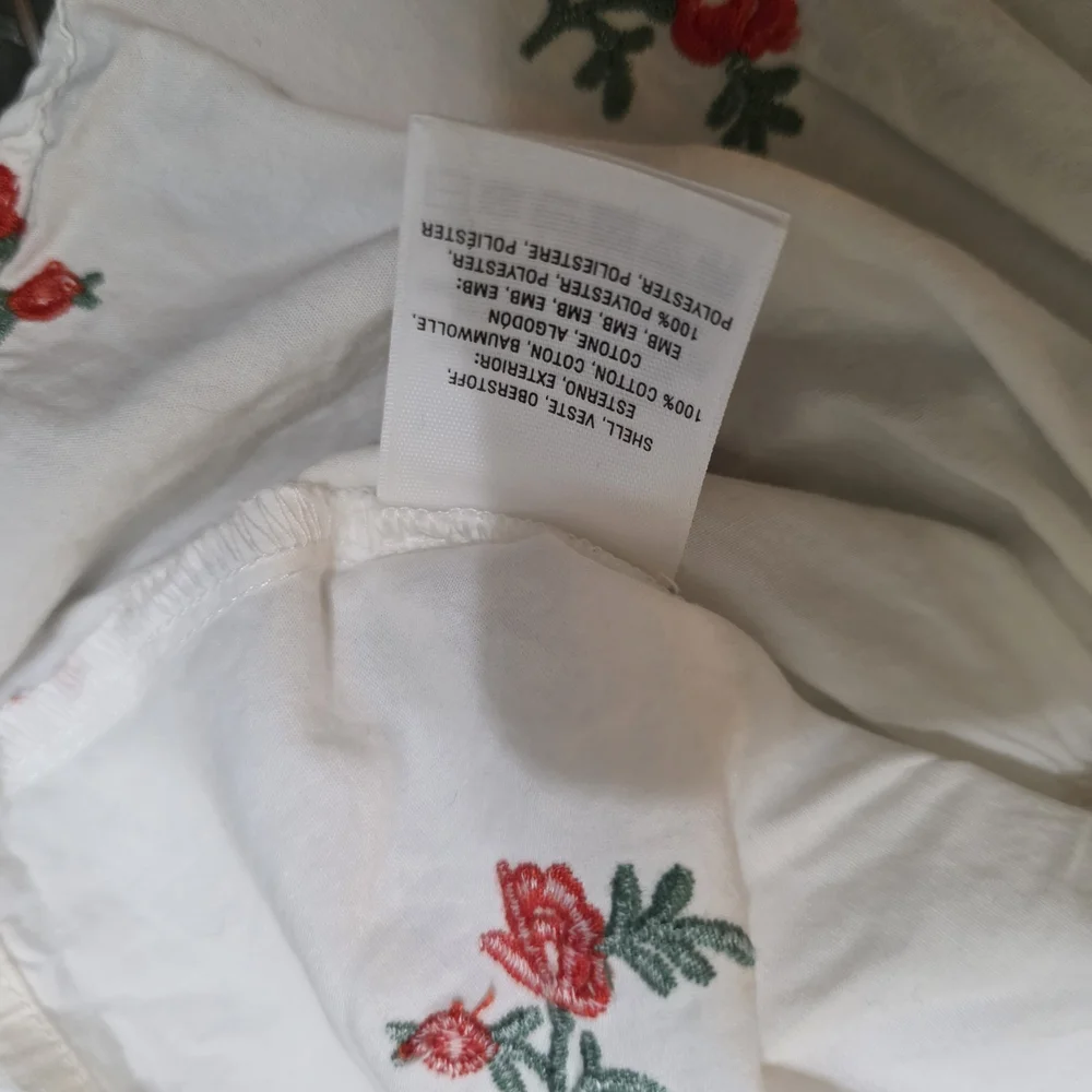 Anthropologie Maeve Embroidered White Floral Wrap Blouse with Red Rose